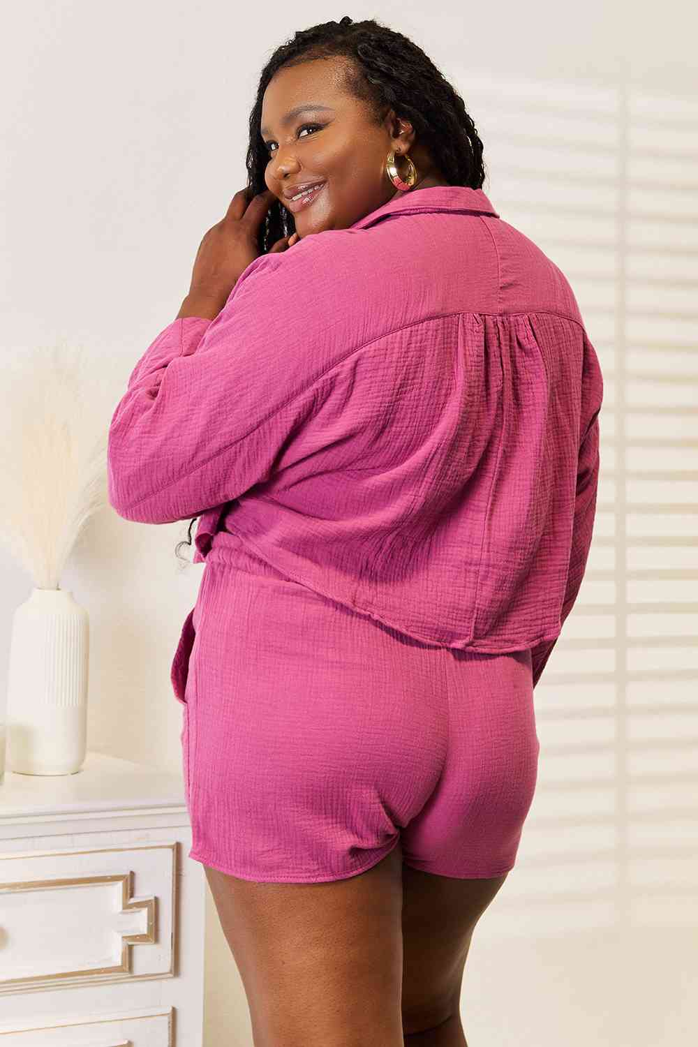 Woman wearing pink colored top and shorts