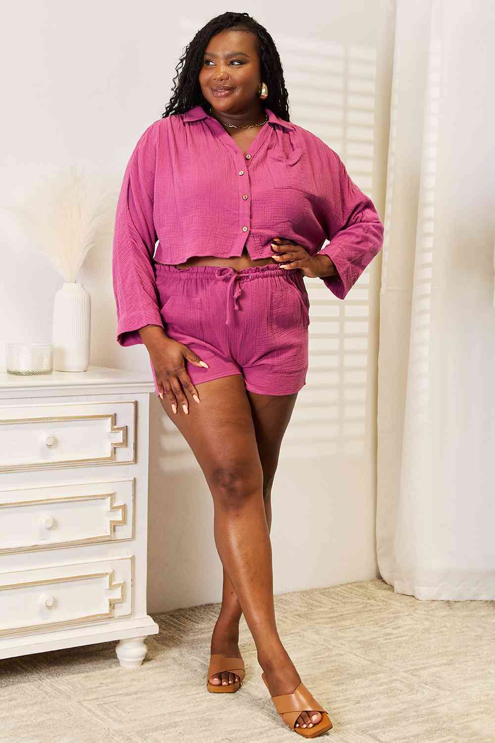Woman wearing pink colored top and shorts