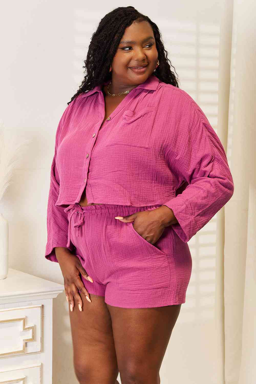 Woman wearing pink colored top and shorts