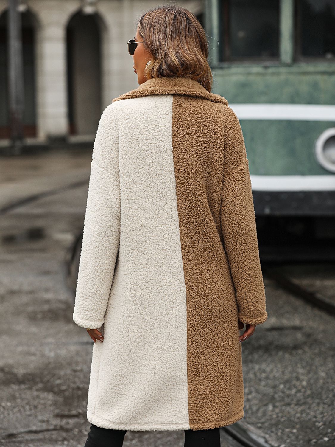 woman in two toned sherpa coat