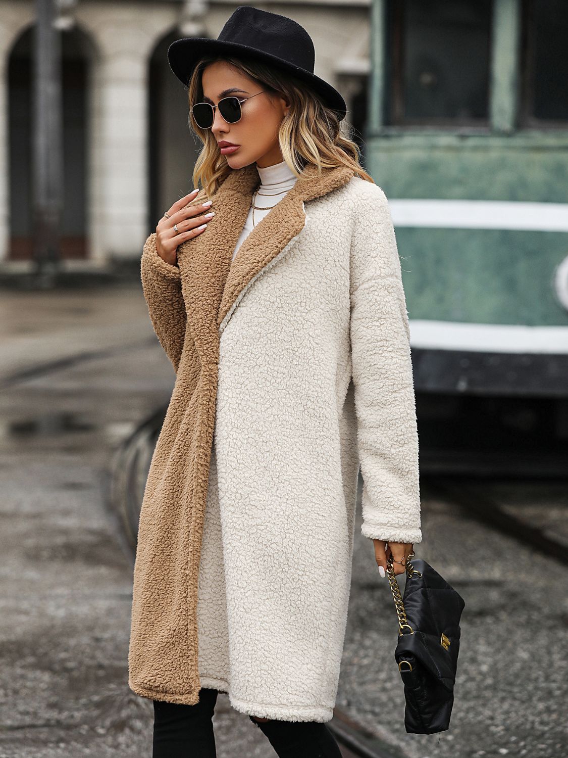 woman in two toned sherpa coat