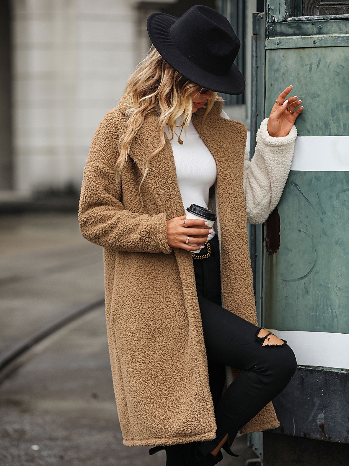 woman in two toned sherpa coat