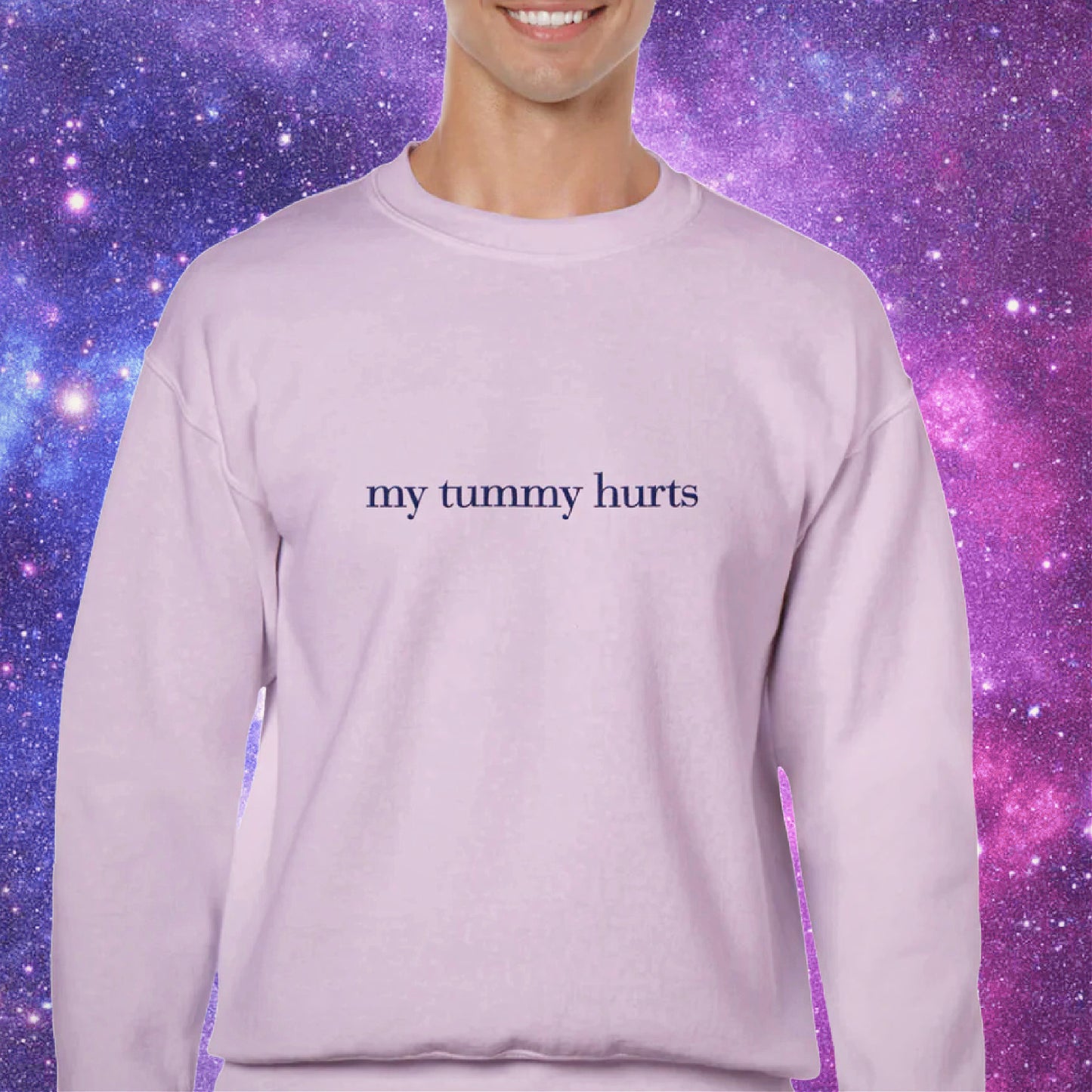 Man wearing sweatshirt that says “my tummy hurts”