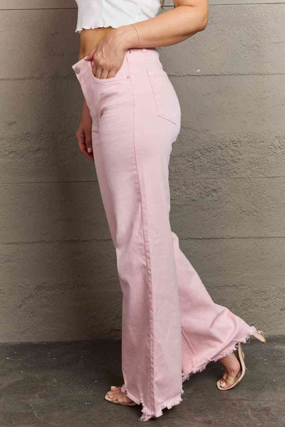 Woman wearing light pink jeans