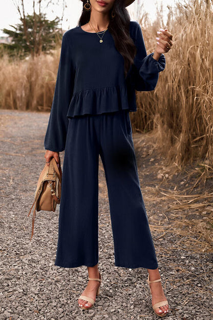 Woman wearing dark blue top and pants