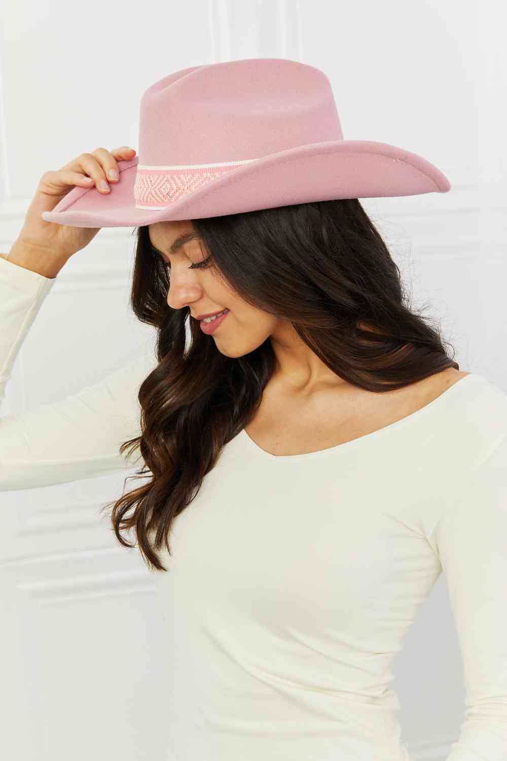 Woman wearing pink cowboy hat