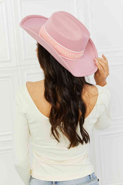 Woman wearing pink cowboy hat