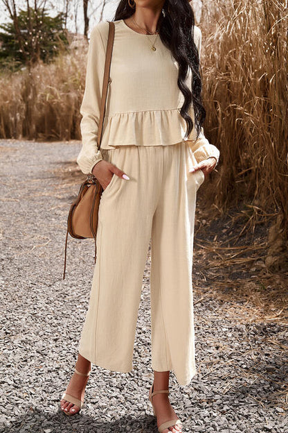 Woman wearing cream colored top and pants