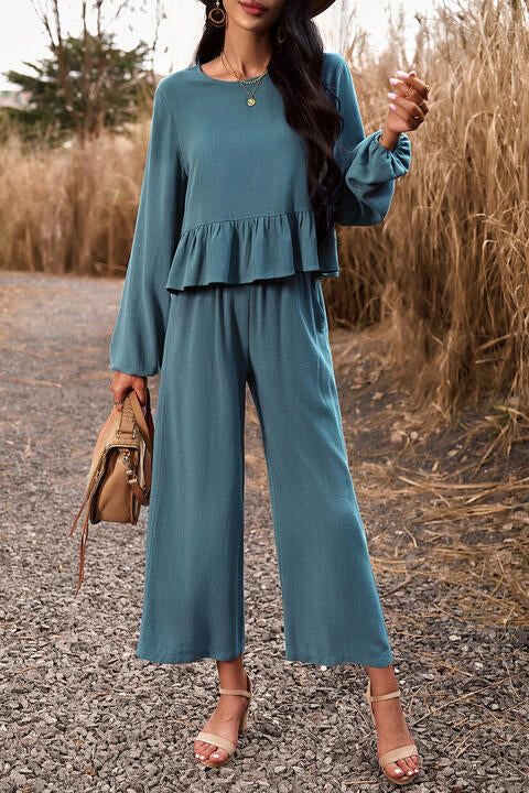 Woman wearing turquoise top and pants