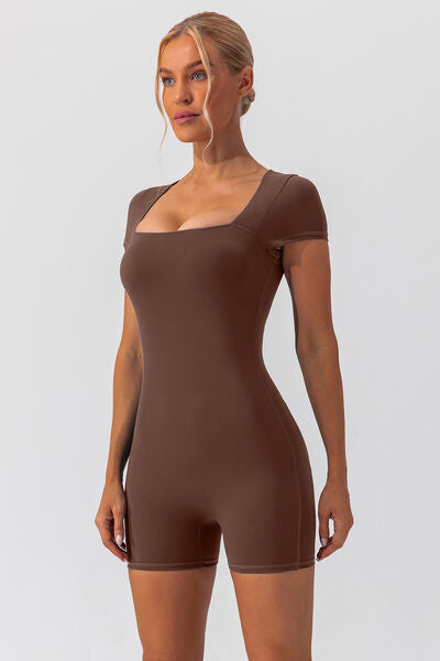 Woman wearing brown shapewear romper