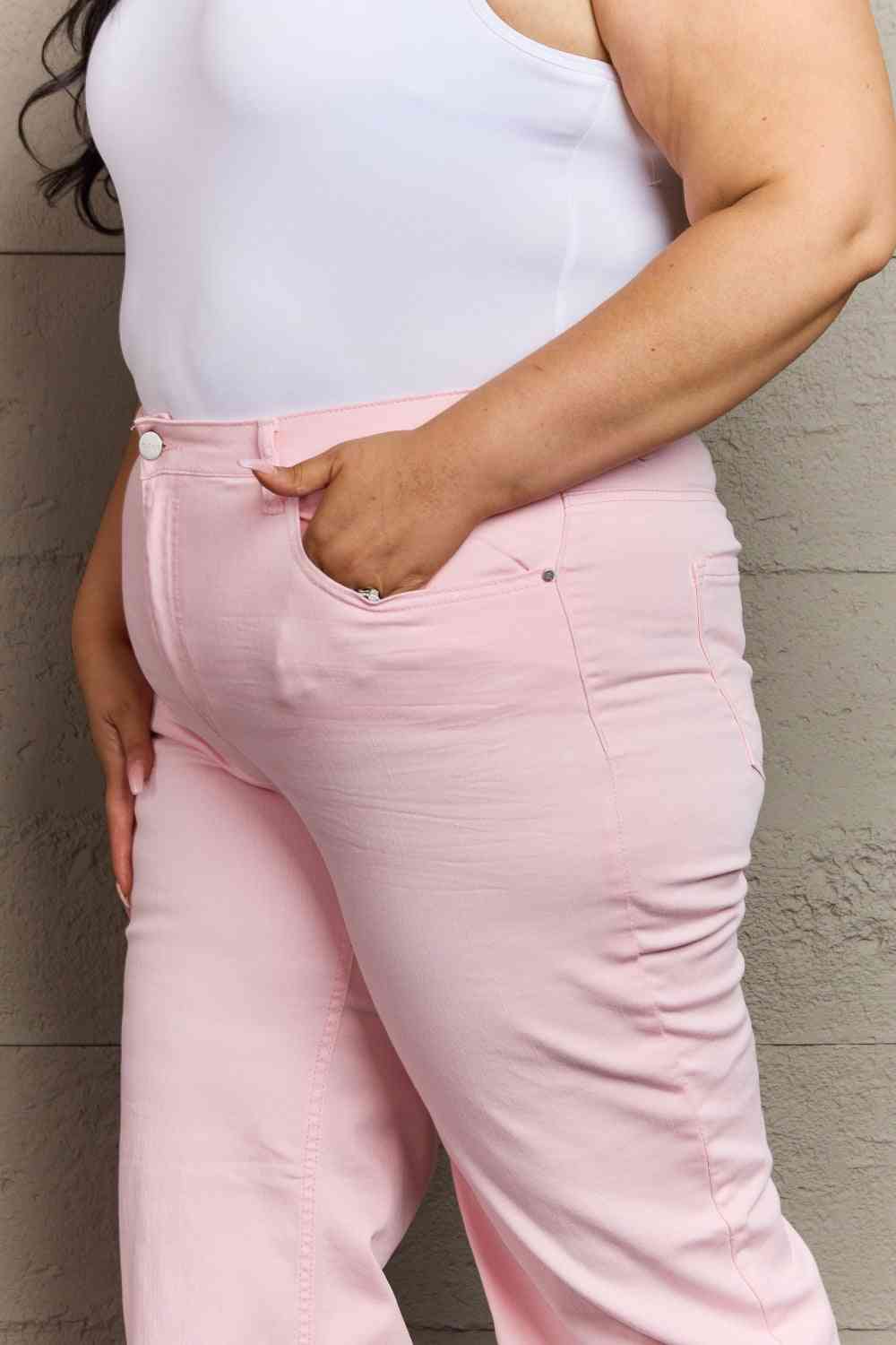 Woman wearing light pink jeans