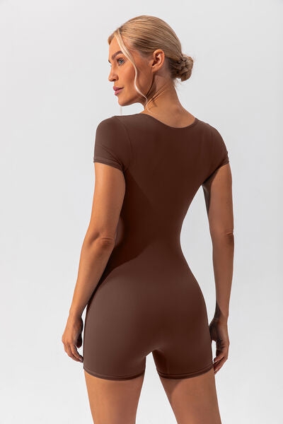 Woman wearing brown shapewear romper