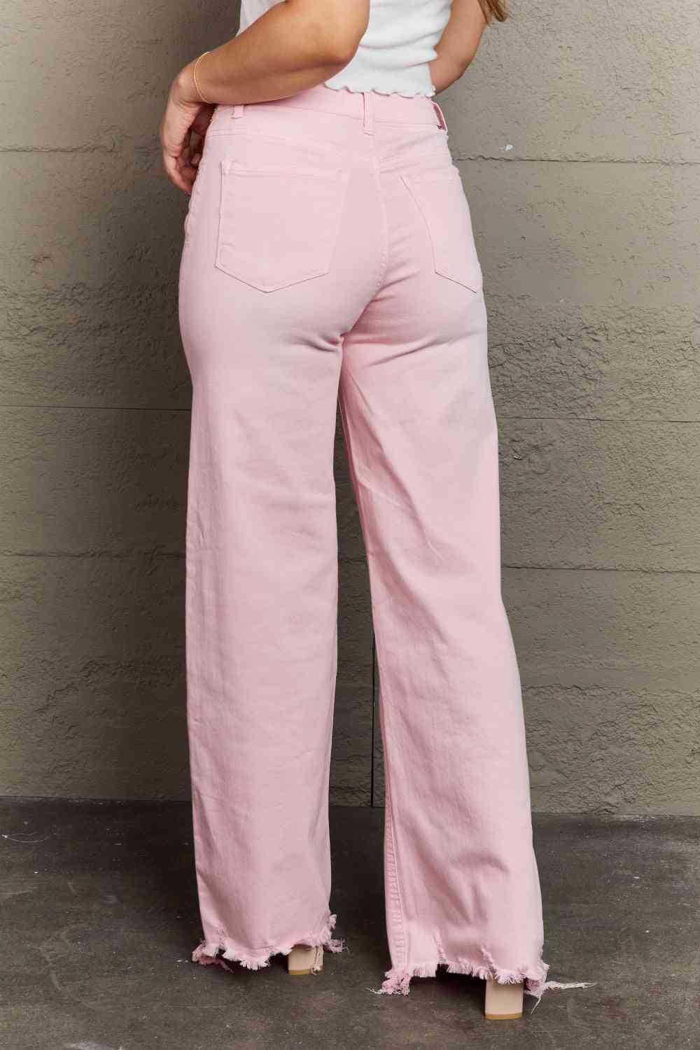 Woman wearing light pink jeans