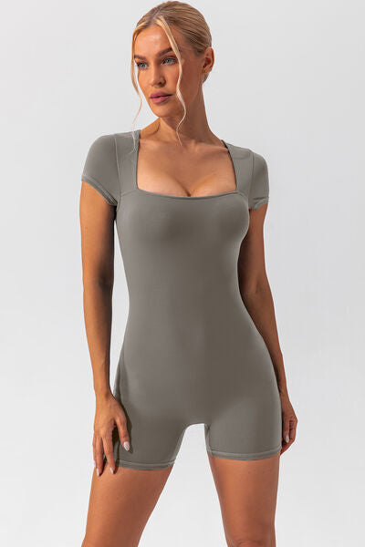 Woman wearing gray shapewear romper