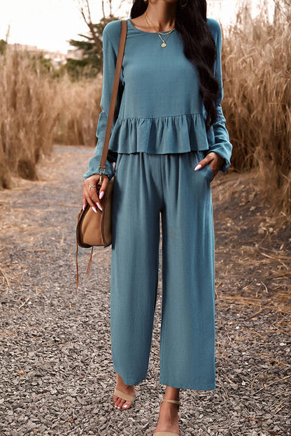 Woman wearing turquoise top and pants