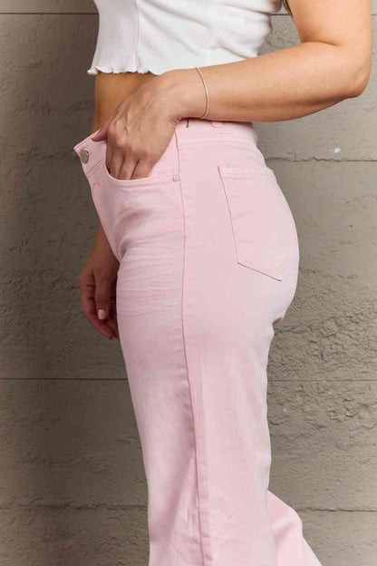 Woman wearing light pink jeans