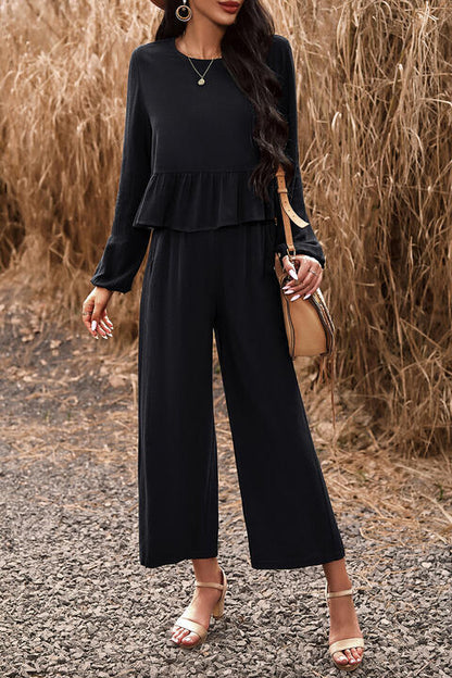 Woman wearing black top and pants