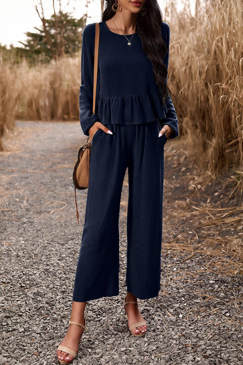 Woman wearing dark blue top and pants